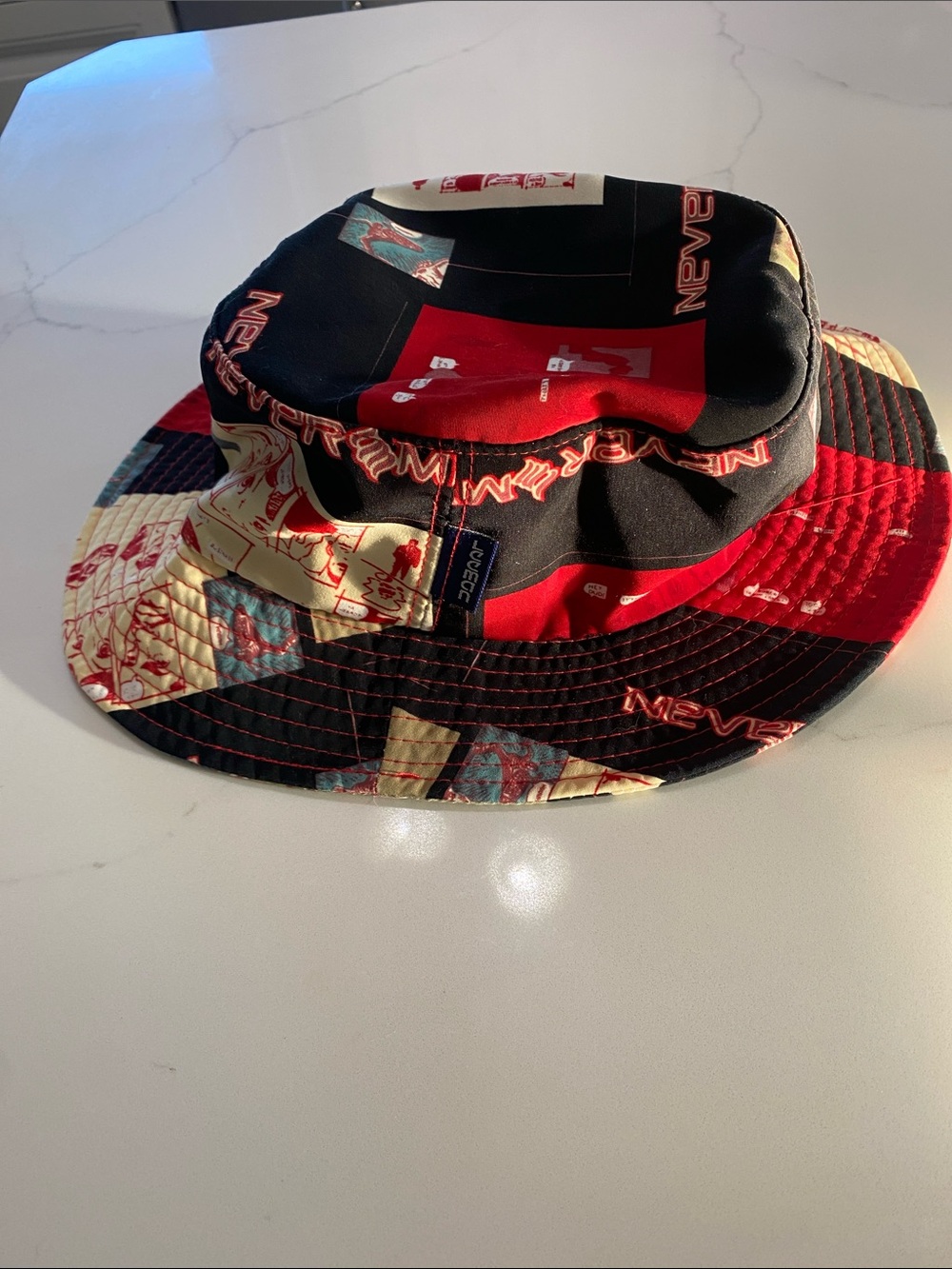 LEEMAN Men's Patchwork Comic Strip Bucket Hat in Black & Red